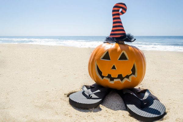 Happy Halloween Pumpkin on the Beach