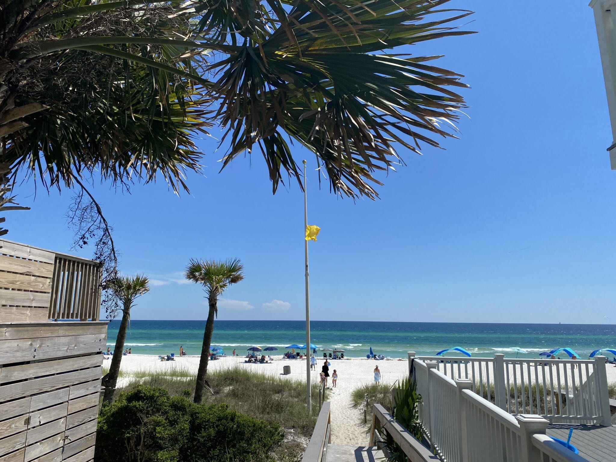 Yellow flag flying - view from beach access #93 on West End PCB 5/28/22