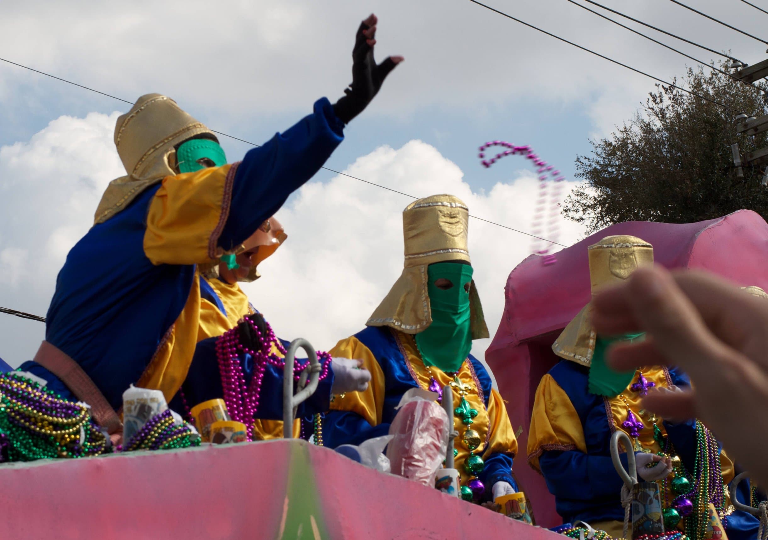 PCB Mardi Gras Parade Participant Throwing Beads